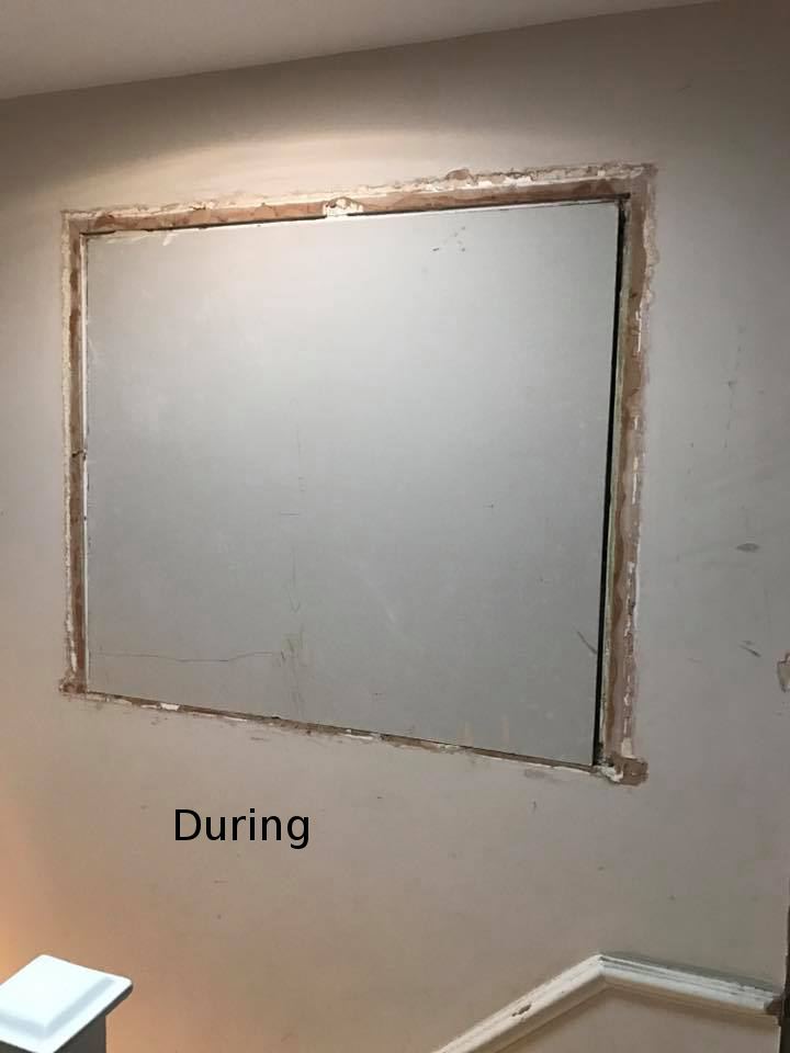 Blocked-up window opening boarded over during plastering by our Maidstone plasterers
