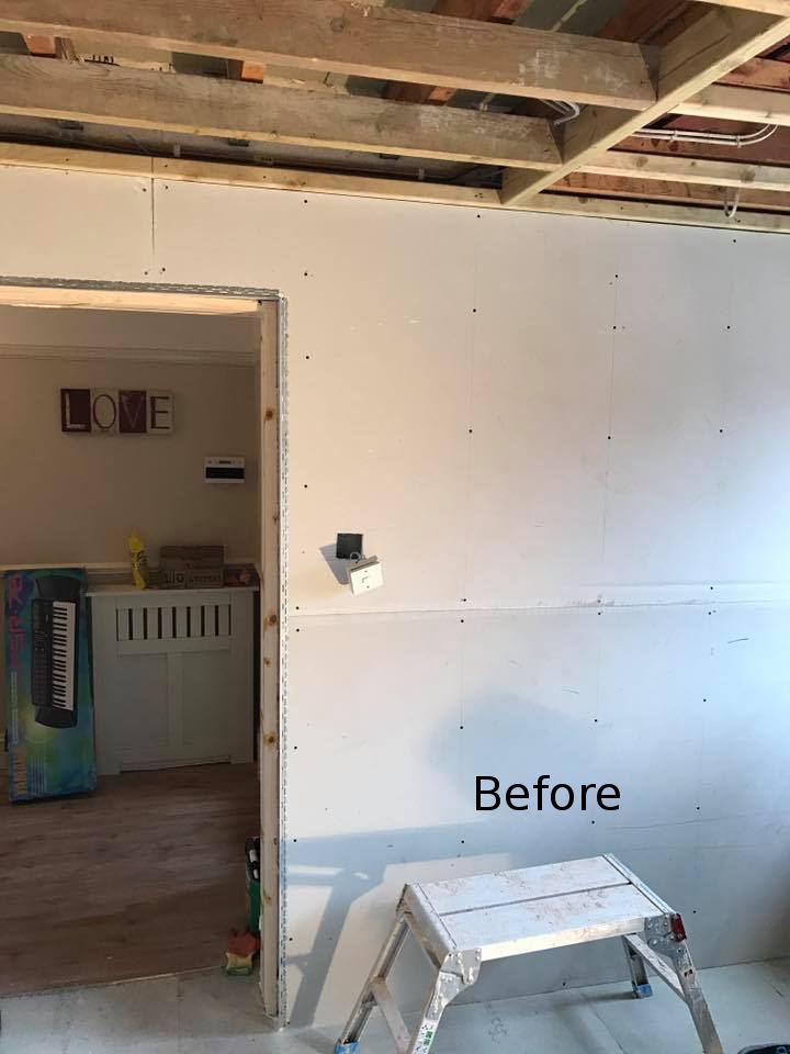 New plasterboard stud wall before skimming by our Maidstone plasterers, with beading round the door opening